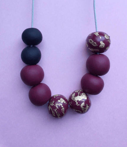 Nine Angels Black, burgundy and gold leaf necklace