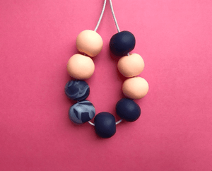 Nine Angels Peach & navy marbled polymer clay necklace